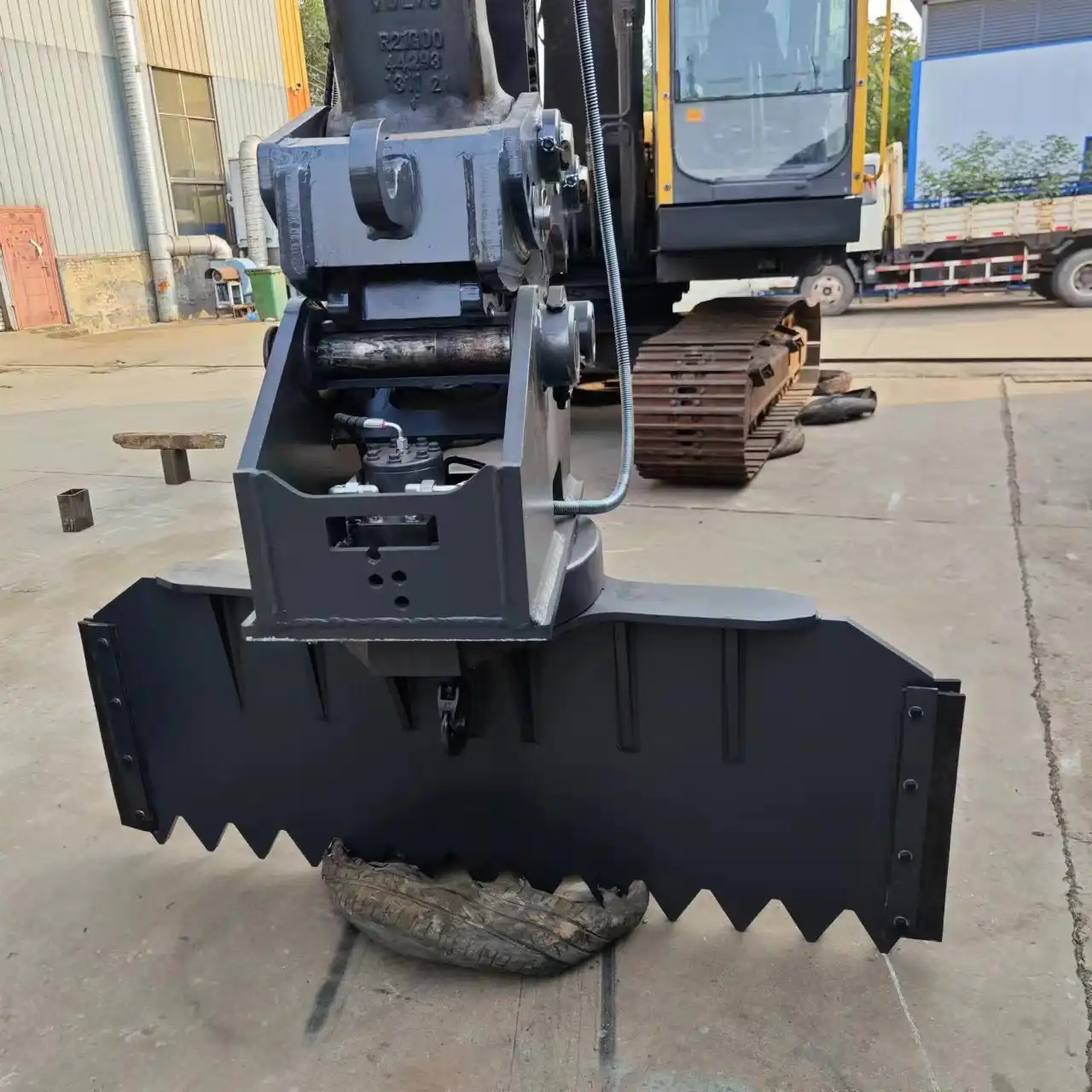 What are the main functions of the excavator rotating scraper in construction and logistics?